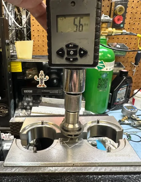 Bushing press tool reading torque during a rebuild